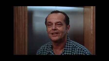 Jack Nicholson als Melvin Udall in einem blauen Hemd.